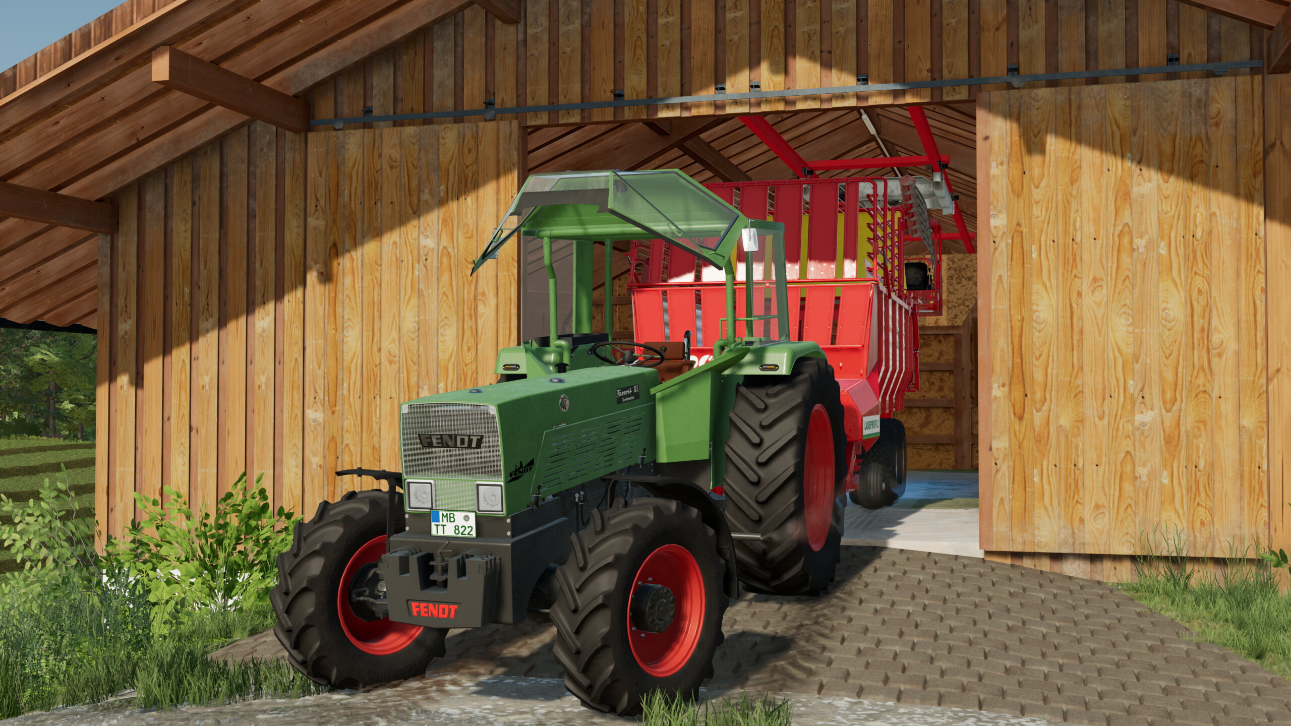 Fendt Favorit 12 SA mit Pöttinger Ladewagen